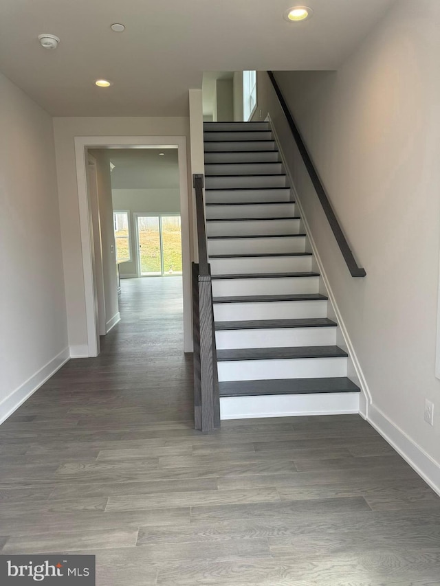 stairway featuring hardwood / wood-style floors