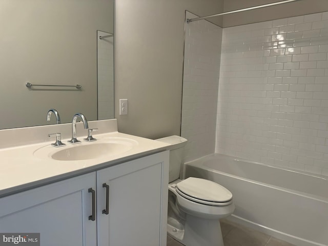 full bathroom featuring tile patterned flooring, vanity, toilet, and tiled shower / bath