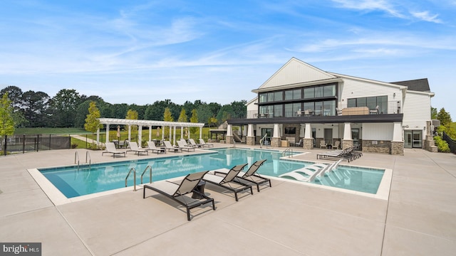 view of swimming pool featuring a patio and a pergola