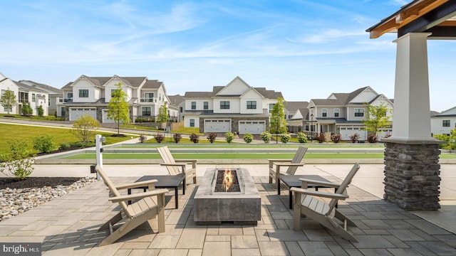 exterior space with a garage and a fire pit