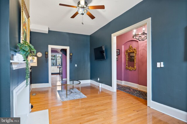 entrance foyer featuring ceiling fan and wood-type flooring