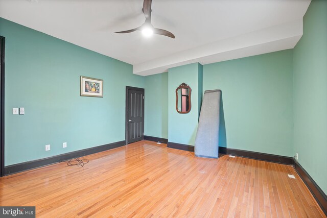 unfurnished room featuring hardwood / wood-style flooring and ceiling fan