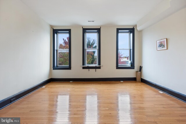 unfurnished room featuring light hardwood / wood-style flooring