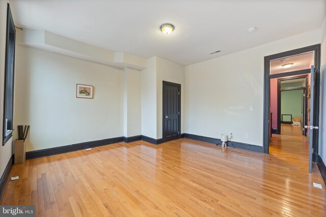 spare room with light wood-type flooring