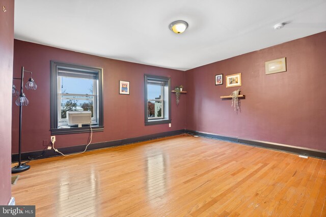 unfurnished room featuring hardwood / wood-style floors