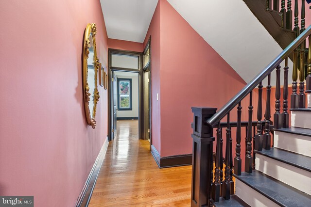 staircase featuring hardwood / wood-style flooring