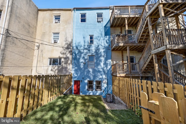 415 E Lafayette Ave, Baltimore, MD 21202 - view of building exterior featuring a fenced backyard, cooling unit, and stairway