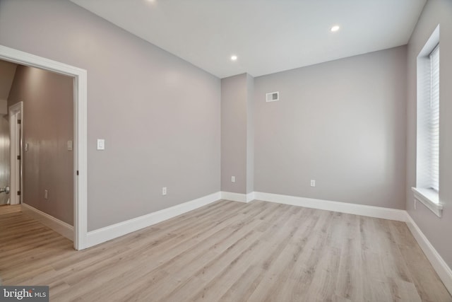 unfurnished room with light hardwood / wood-style floors