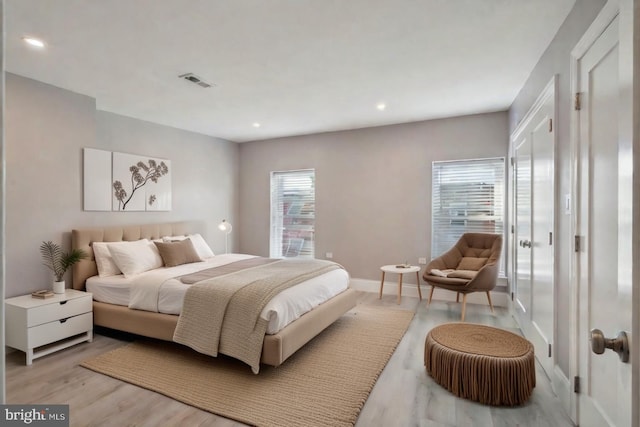 bedroom with light hardwood / wood-style flooring