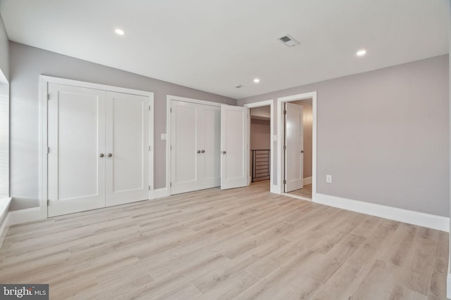 unfurnished bedroom with light hardwood / wood-style floors