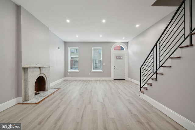 unfurnished living room featuring light hardwood / wood-style flooring