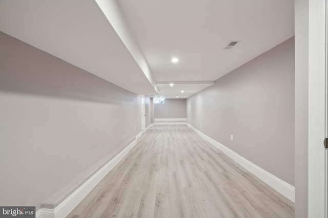 basement featuring light hardwood / wood-style floors