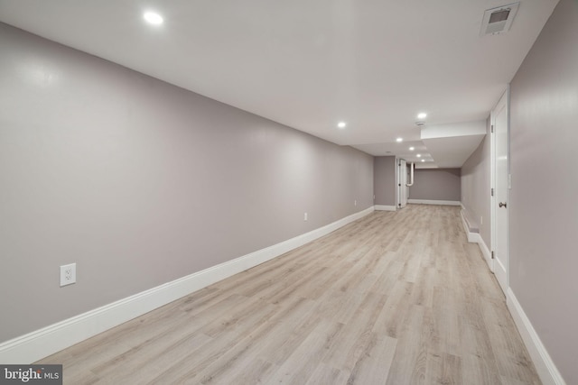 basement featuring light hardwood / wood-style floors