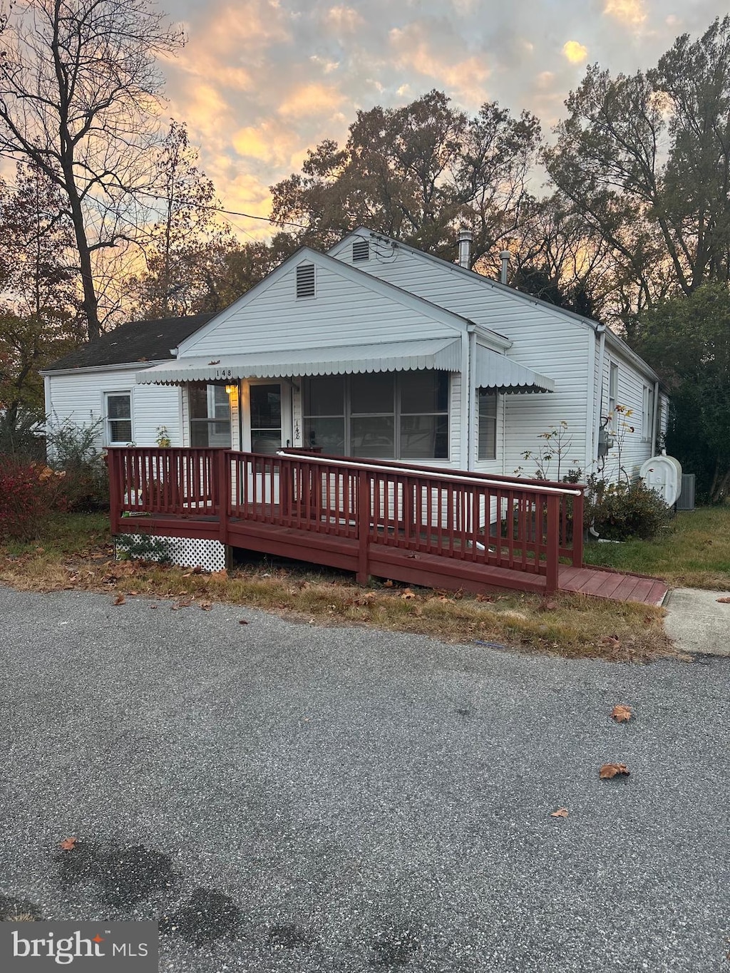 view of front of property with a wooden deck