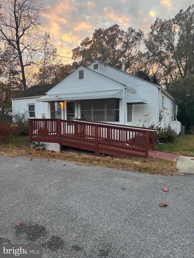 view of front of property with a wooden deck