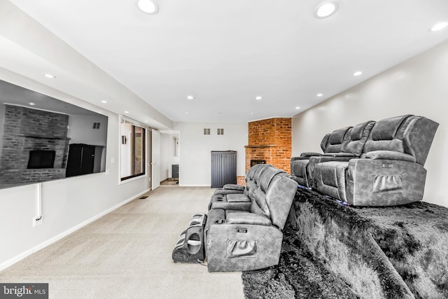 carpeted living room with a fireplace