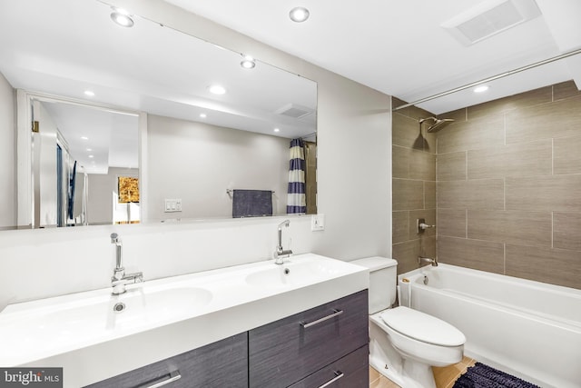 full bathroom with vanity, toilet, and shower / tub combo with curtain