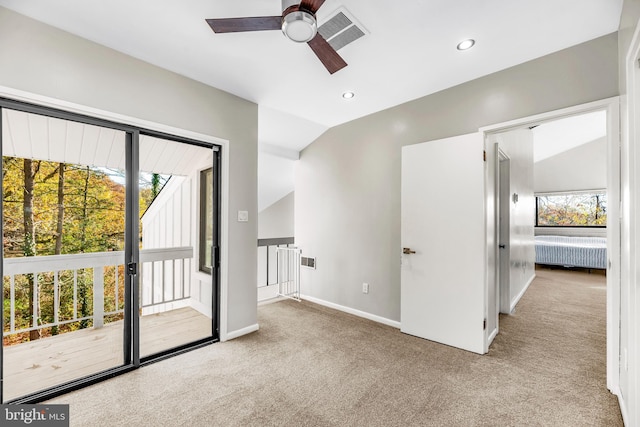 interior space featuring light carpet, radiator heating unit, ceiling fan, and lofted ceiling