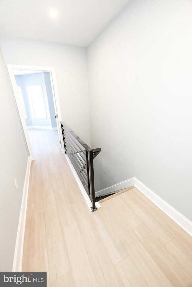 stairs with wood-type flooring