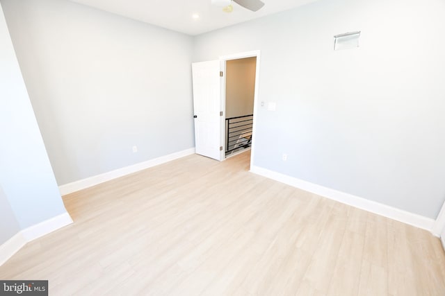 empty room featuring light hardwood / wood-style floors and ceiling fan