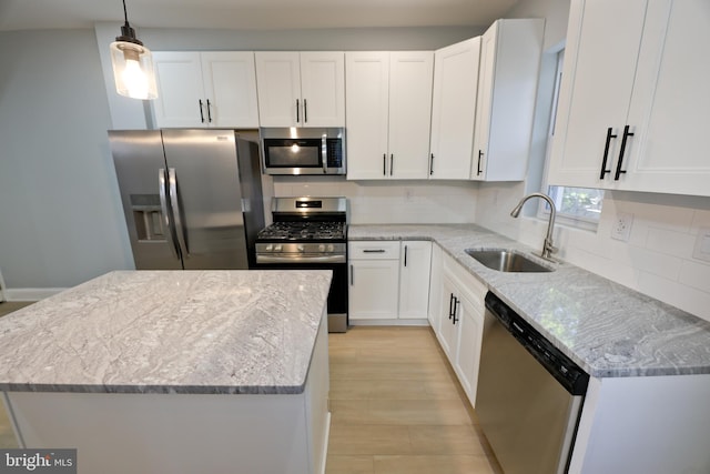 kitchen with white cabinetry, sink, and appliances with stainless steel finishes