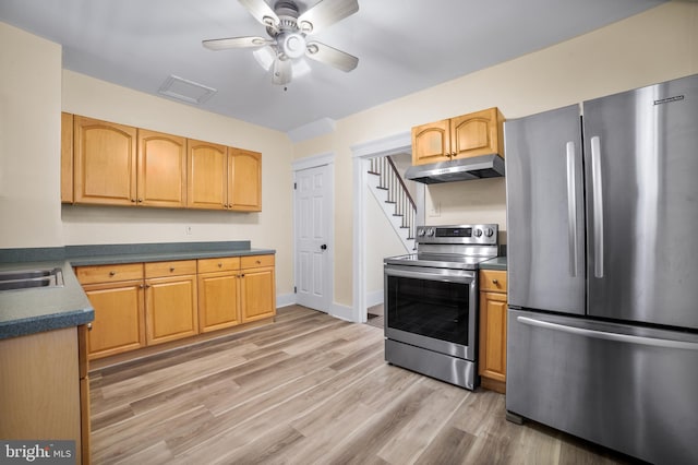 kitchen with appliances with stainless steel finishes, hardwood / wood-style floors, and ceiling fan