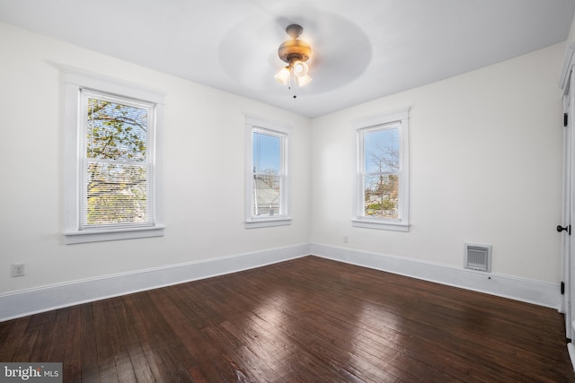 unfurnished room featuring hardwood / wood-style floors, plenty of natural light, and ceiling fan