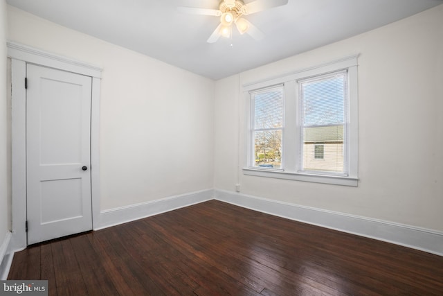 spare room featuring hardwood / wood-style flooring and ceiling fan