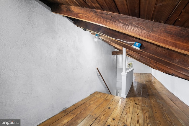 interior space featuring hardwood / wood-style floors and wooden ceiling