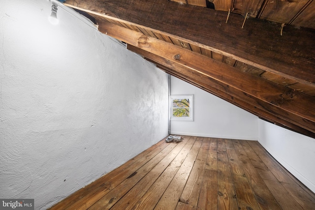 bonus room featuring lofted ceiling and hardwood / wood-style floors