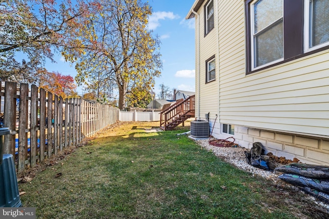 view of yard with central air condition unit