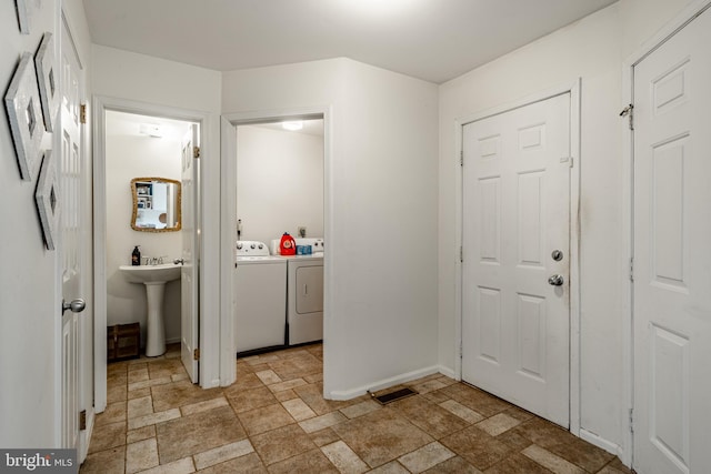 entrance foyer featuring independent washer and dryer