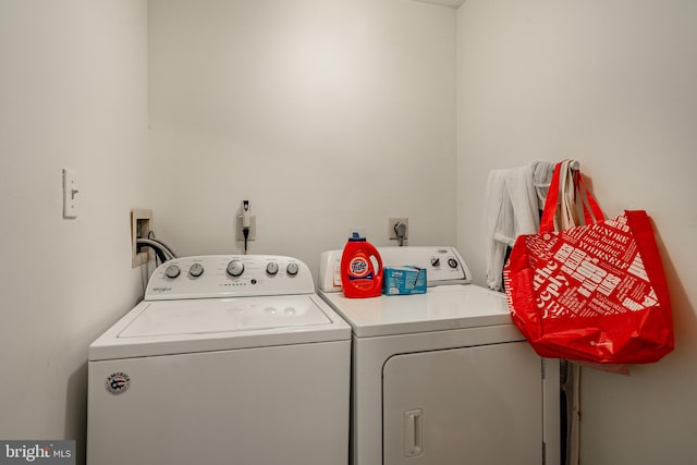 laundry area with separate washer and dryer