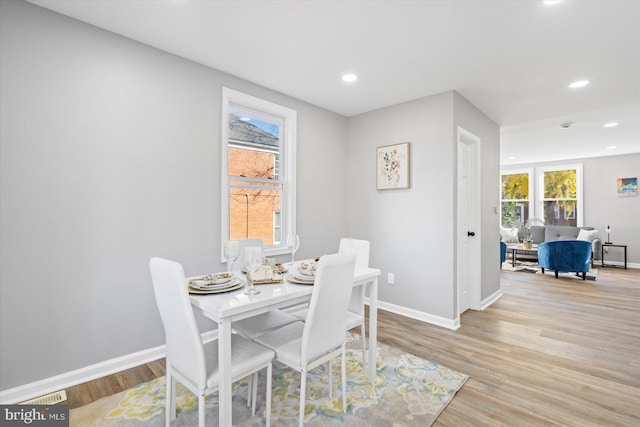 dining space featuring light wood-type flooring