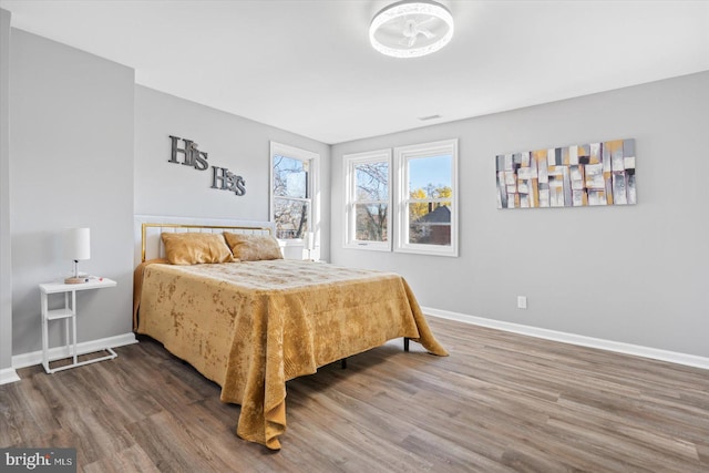 bedroom with hardwood / wood-style floors