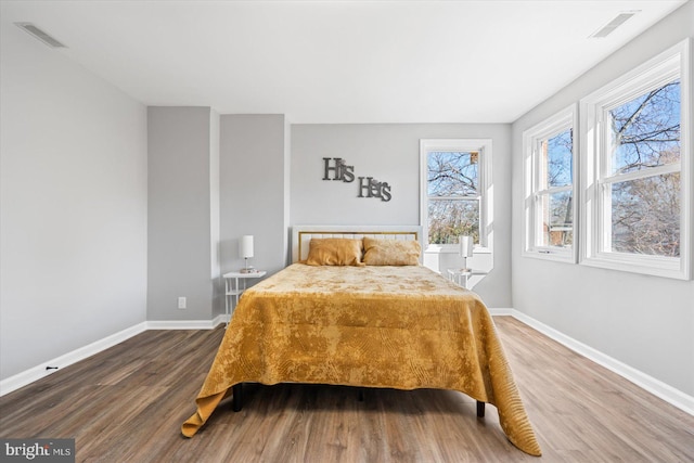 bedroom featuring hardwood / wood-style flooring