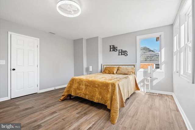 bedroom with hardwood / wood-style flooring