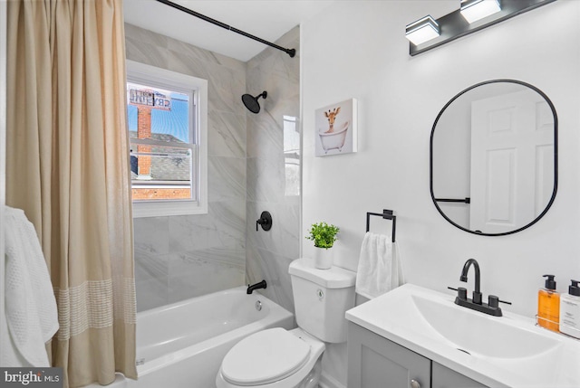 full bathroom featuring vanity, shower / bath combo with shower curtain, and toilet