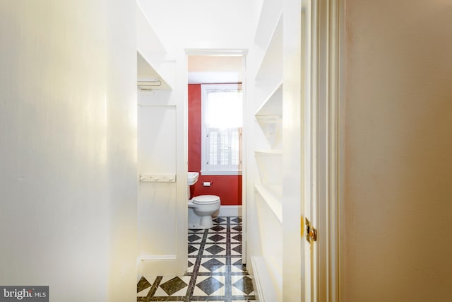 bathroom with tile patterned flooring and toilet