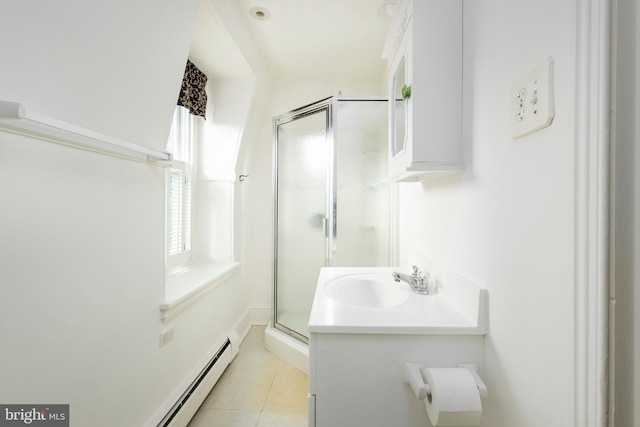 bathroom with vanity, tile patterned floors, and a shower with door