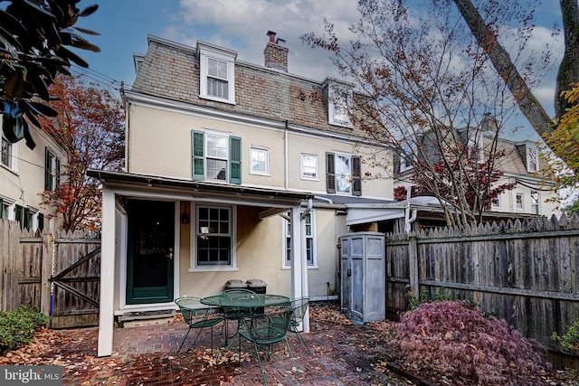 rear view of property with a patio