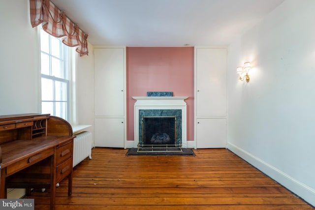 living room featuring radiator and hardwood / wood-style flooring