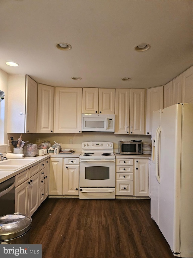 kitchen featuring sink, dark hardwood / wood-style floors, and stainless steel appliances