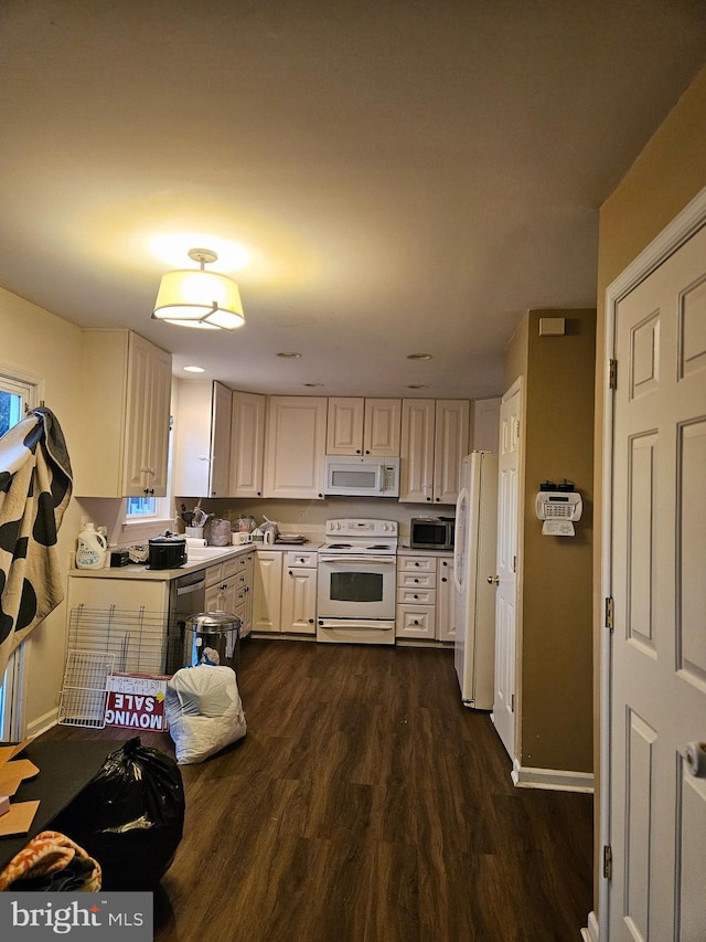 kitchen with stainless steel appliances and dark hardwood / wood-style floors