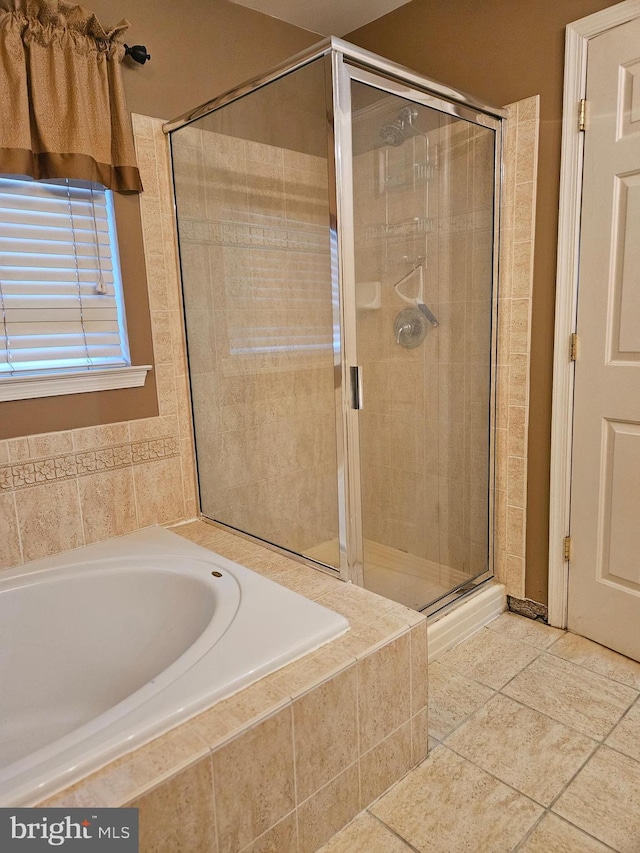 bathroom featuring tile patterned floors and plus walk in shower