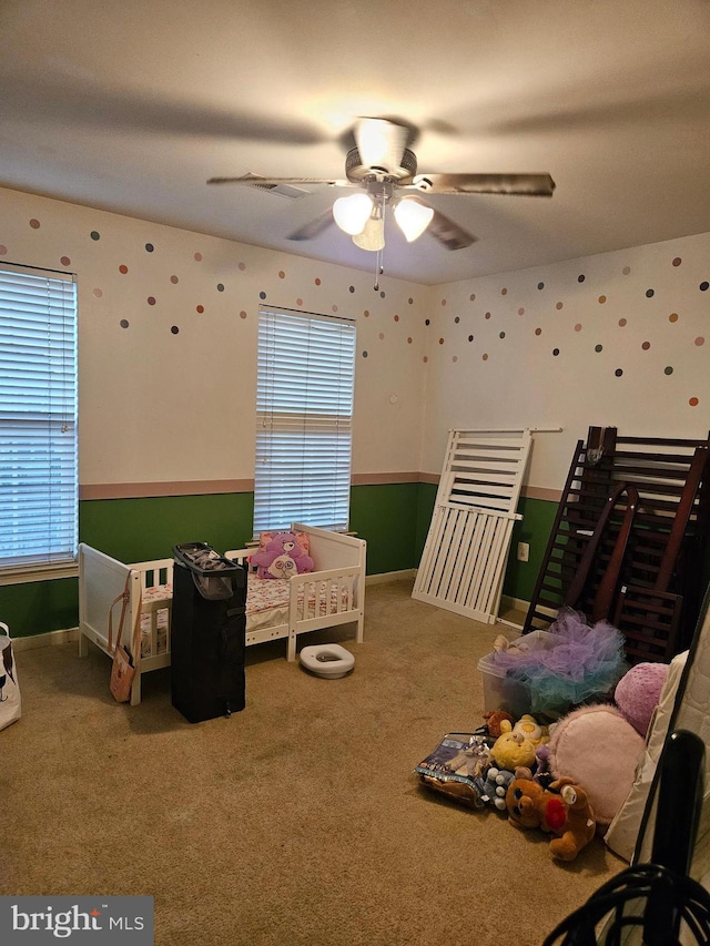 bedroom with ceiling fan and carpet