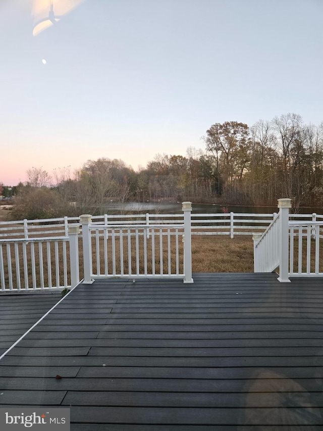 deck at dusk with a rural view