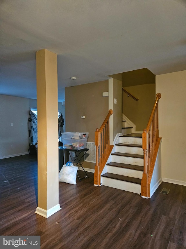 staircase featuring hardwood / wood-style floors