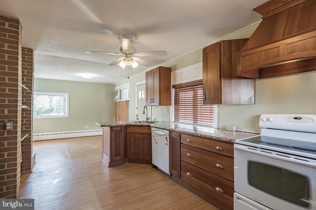 kitchen featuring sink, light hardwood / wood-style flooring, a baseboard heating unit, white appliances, and custom range hood