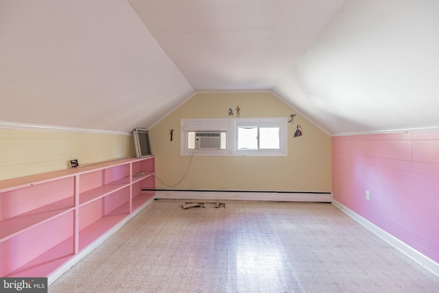 bonus room featuring a baseboard radiator and vaulted ceiling